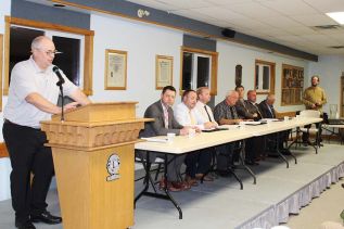 From left: Council candidates Bruno Albano, Brad Barbeau, Tom Bruce, Doug Morey and Ray Leonard; mayoralty candidates Phil Archambault, Mark Schjerning and Ron Vandewal; moderator Jeff Green. Photo/Craig Bakay
